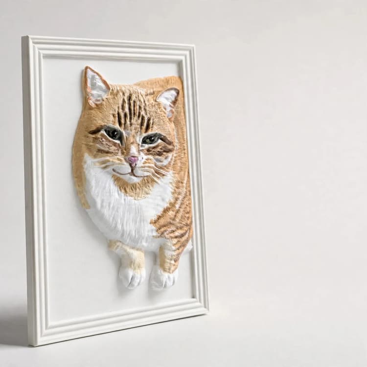 A realistically hand-painted 3D pet relief in a white frame — the pet's real colors in raised relief
